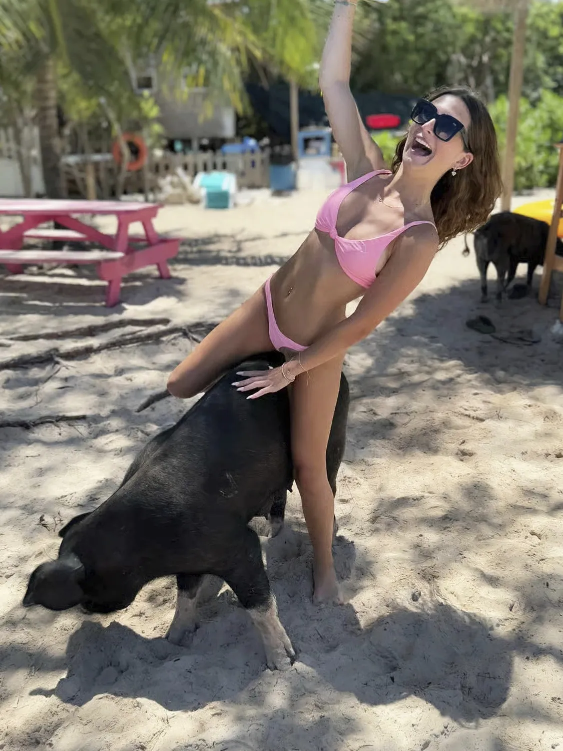 Woman riding a pig
