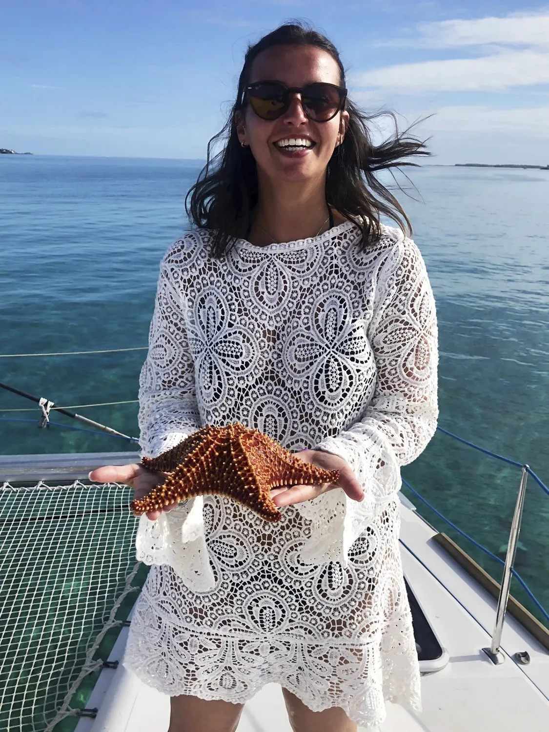 Woman carrying a starfish
